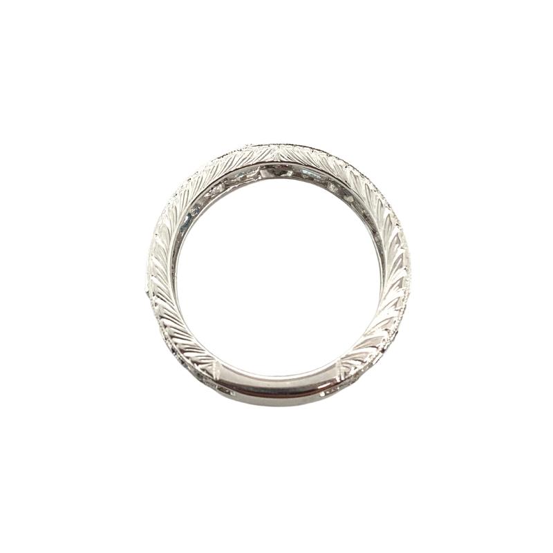 a silver ring with an intricate design on it