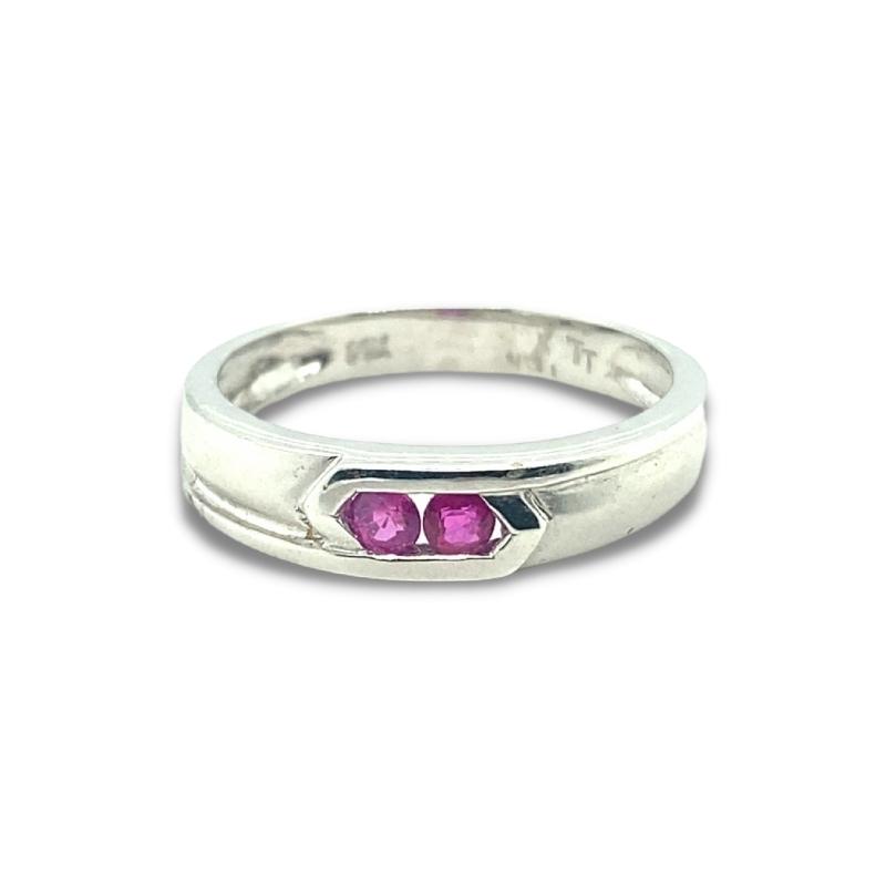 a silver ring with two pink stones on it