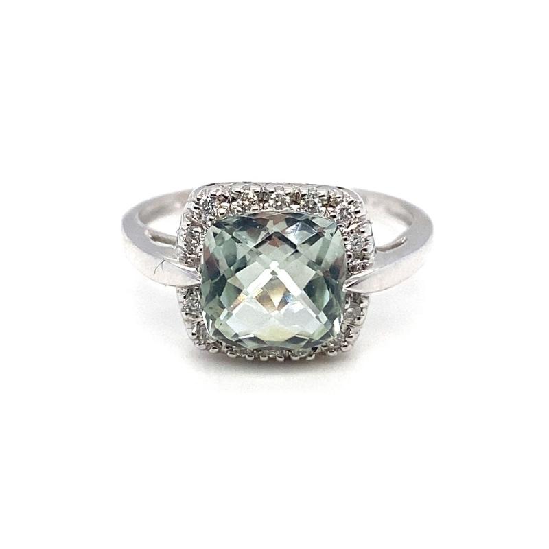 a ring with an aqua blue topazte surrounded by diamonds