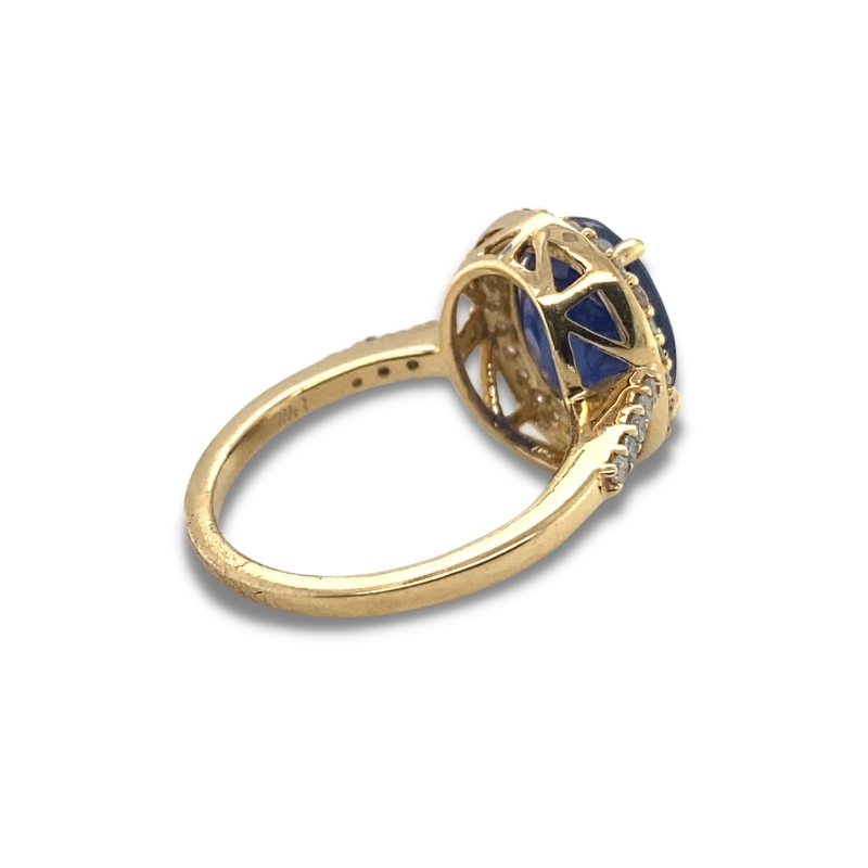 a gold ring with blue stones on it