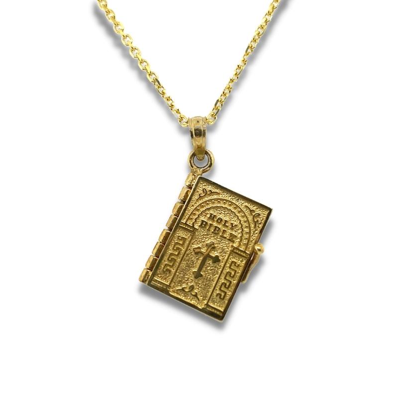 a gold necklace with an open door on it