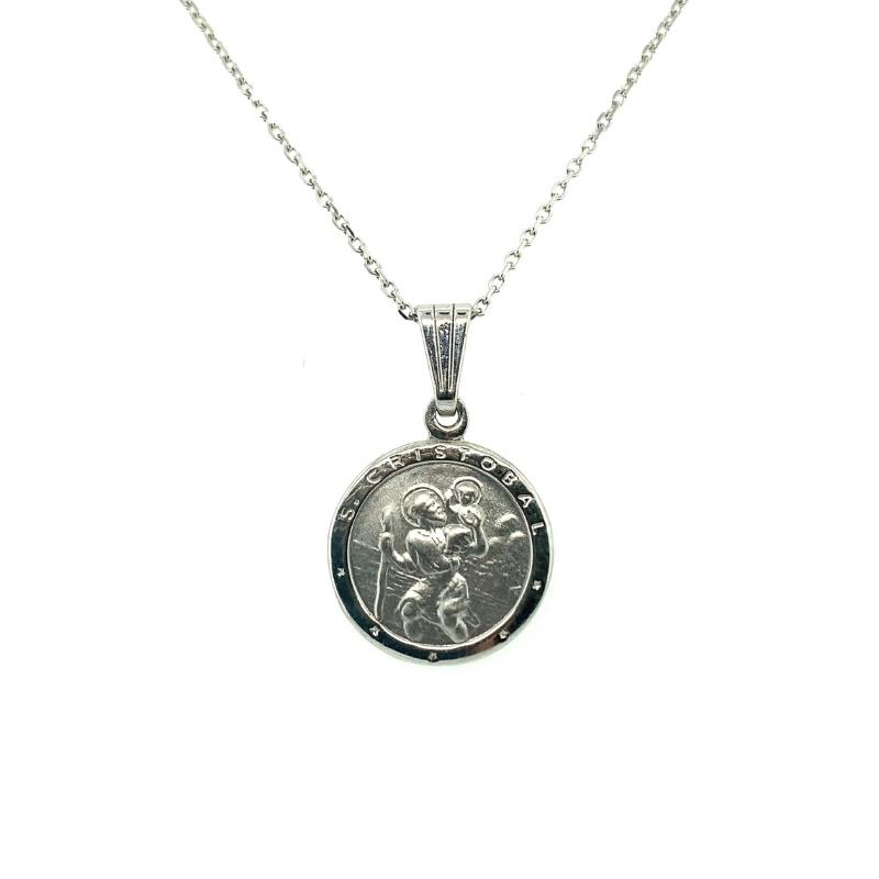 a silver necklace with a coin on it