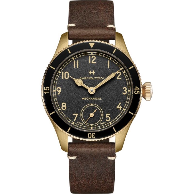 a black and gold watch with brown leather straps