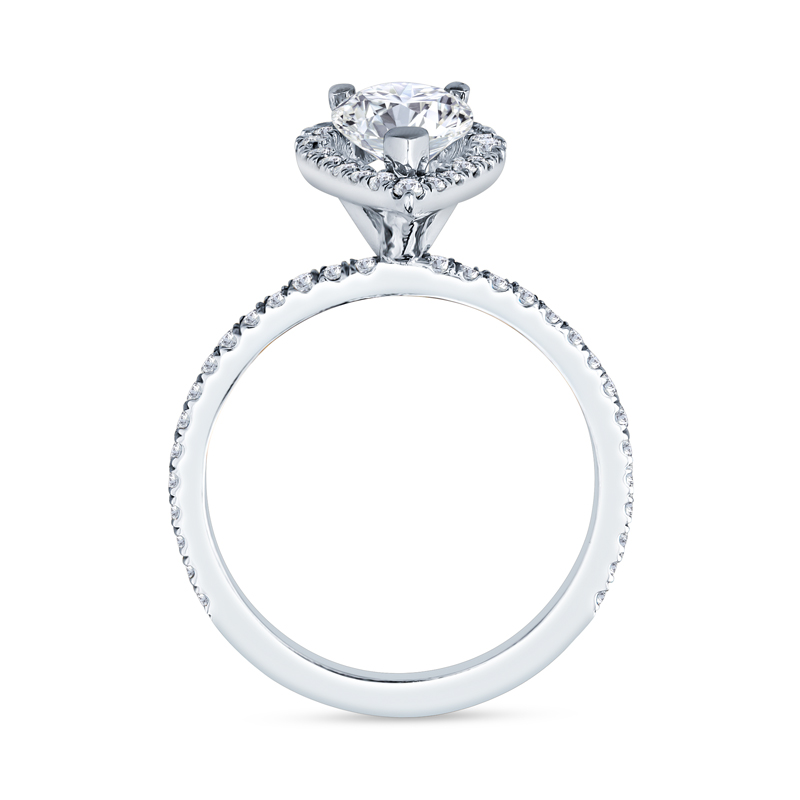 a white gold engagement ring with a round diamond center