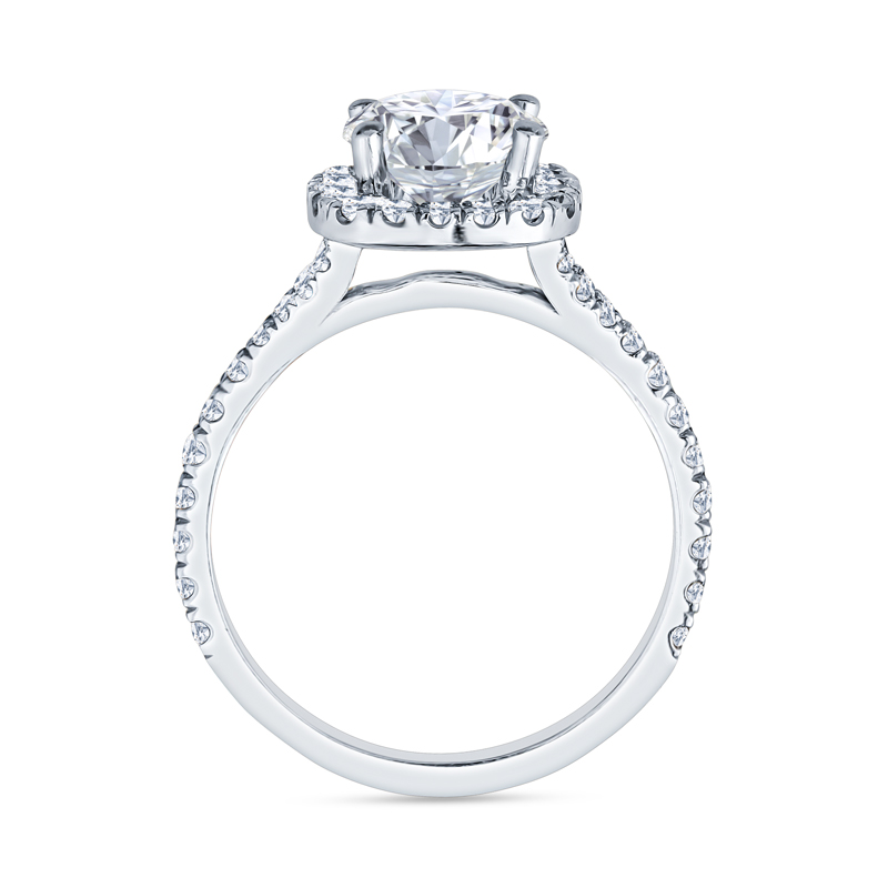 a white gold engagement ring with an oval cut diamond center