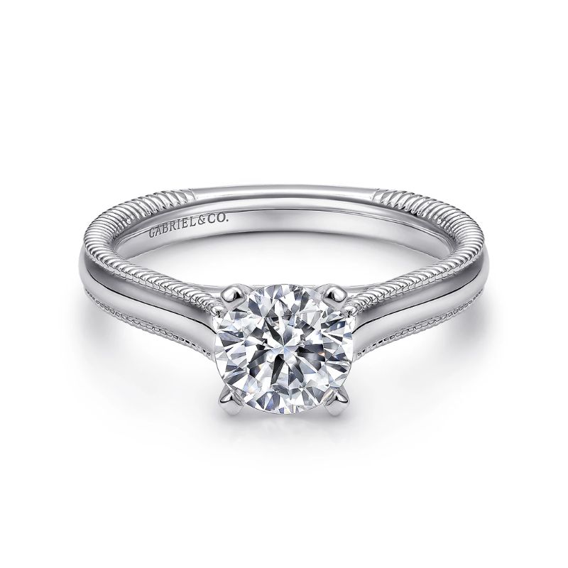 a white gold engagement ring with a twisted band
