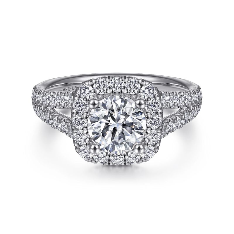 a diamond engagement ring with halos on the band