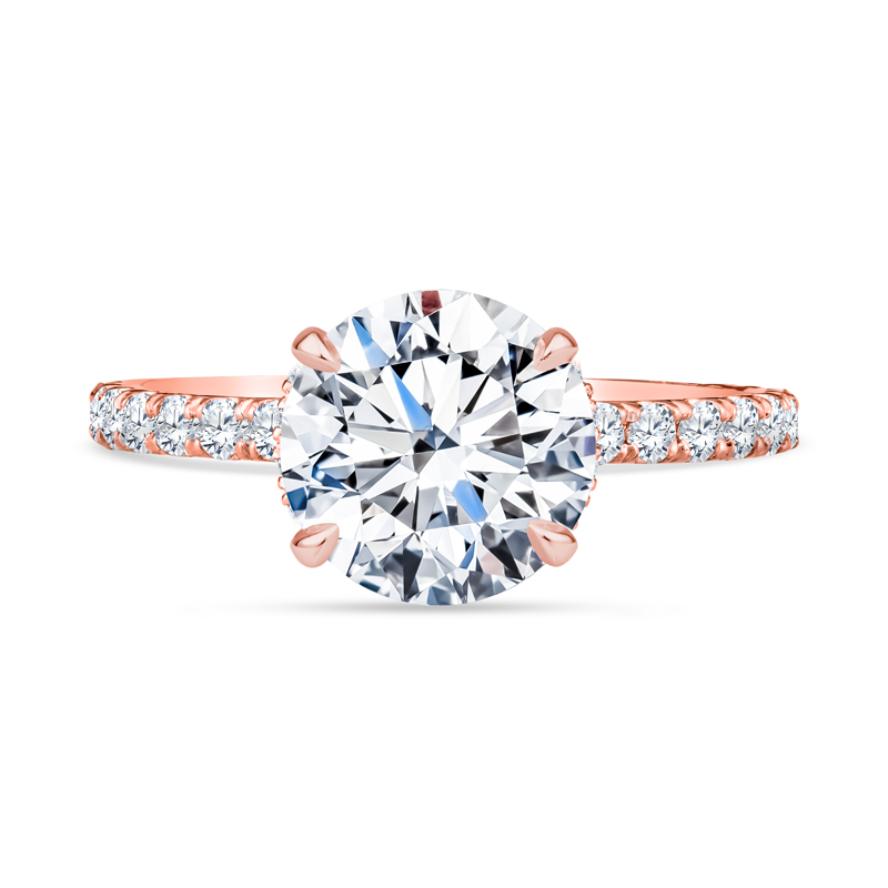 a rose gold engagement ring with diamonds on it