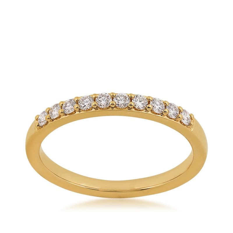 a yellow gold ring with three rows of diamonds