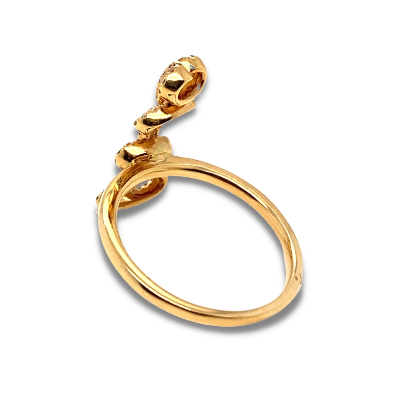 a gold ring with three balls on it