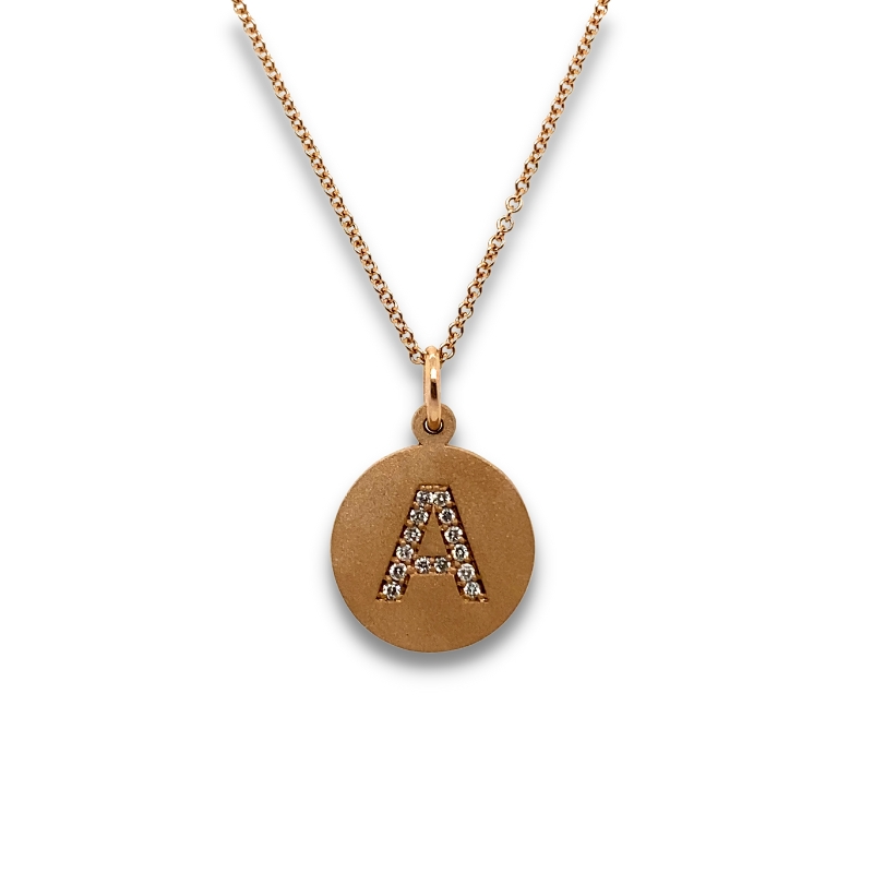 a pendant with the letter a on it