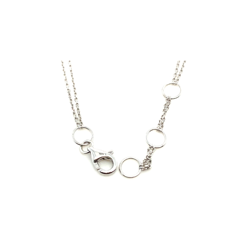 a silver necklace with circles on it