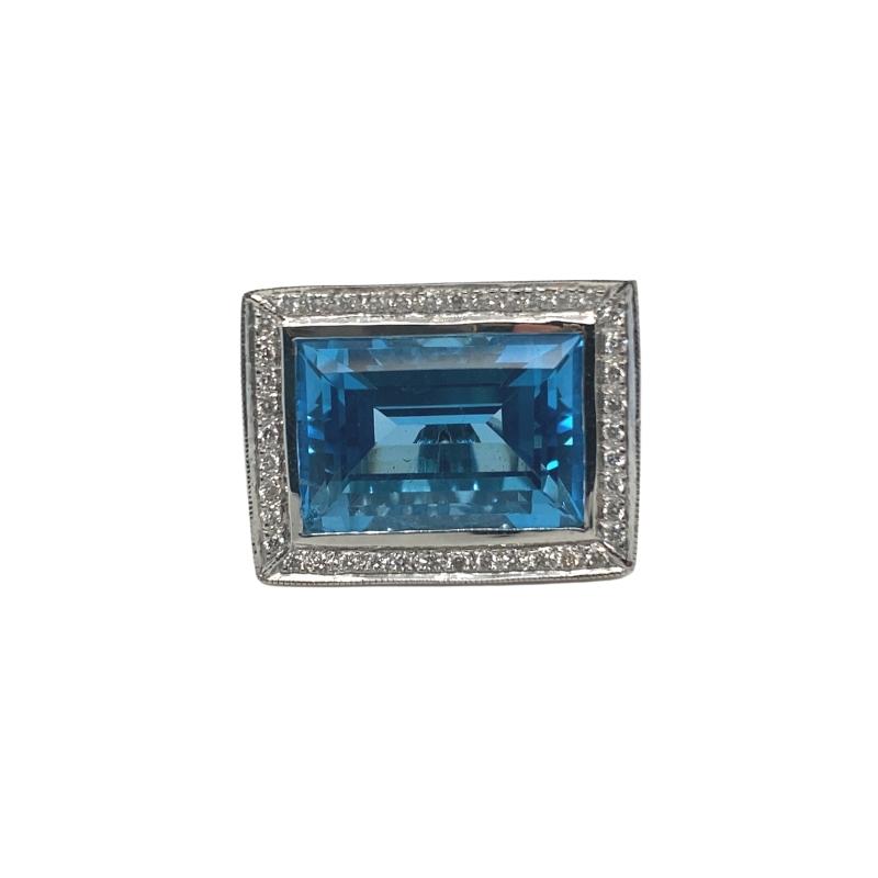 a blue ring with diamonds on it