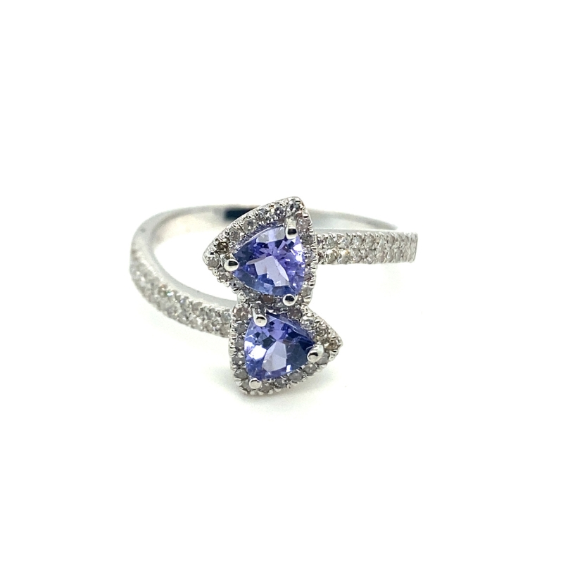 two tan and white gold rings with blue sapphires