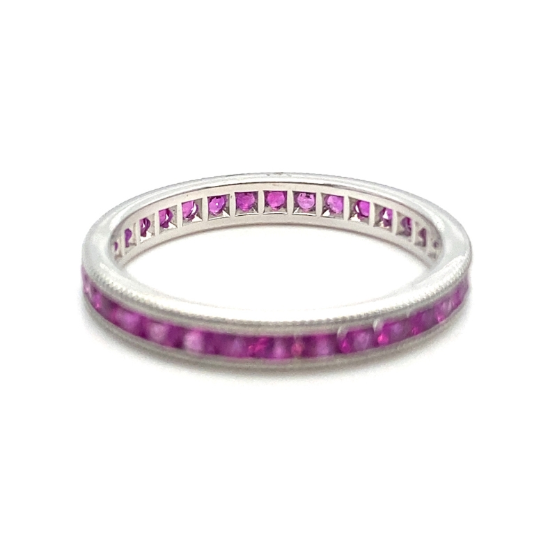a white gold ring with pink stones