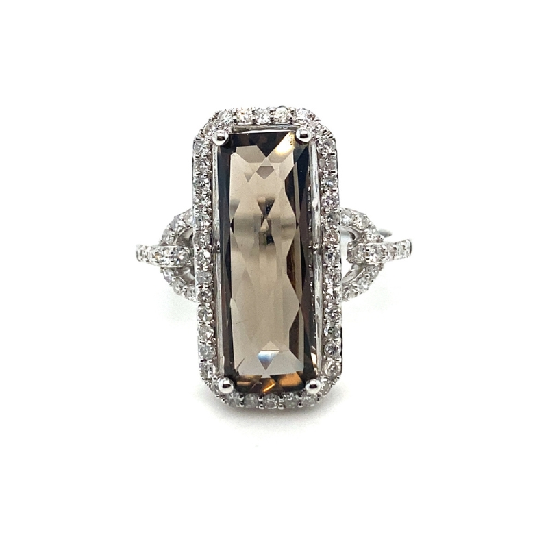 a ring with a large stone surrounded by diamonds