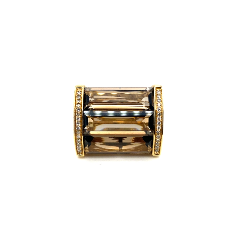a gold ring with two rows of diamonds