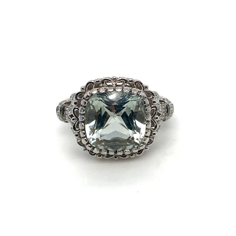 a ring with an aqua green stone in the center