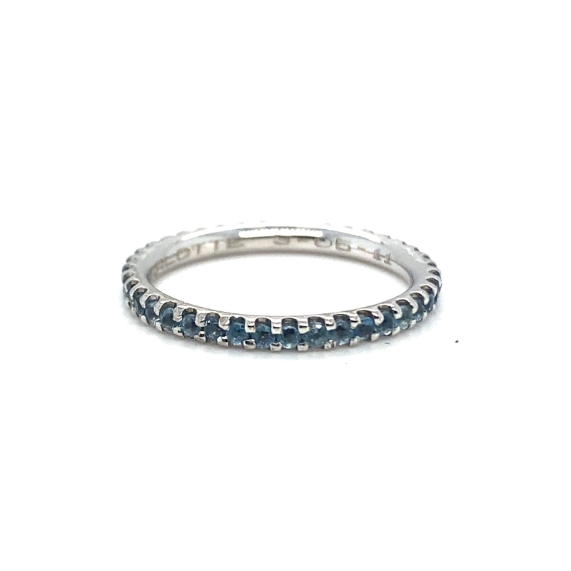 a white gold ring with blue diamonds