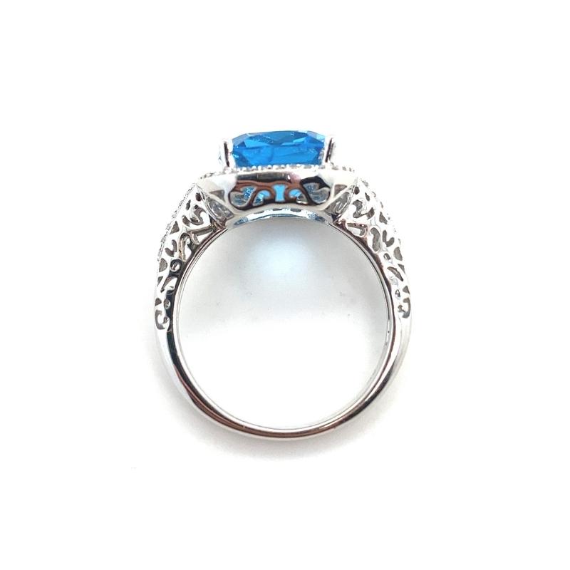 a ring with a blue stone in the center