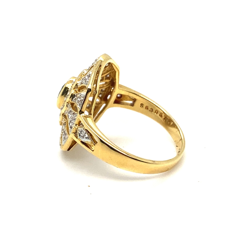 a yellow gold ring with diamonds on it