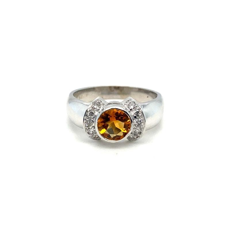 a white gold ring with an orange and white diamond