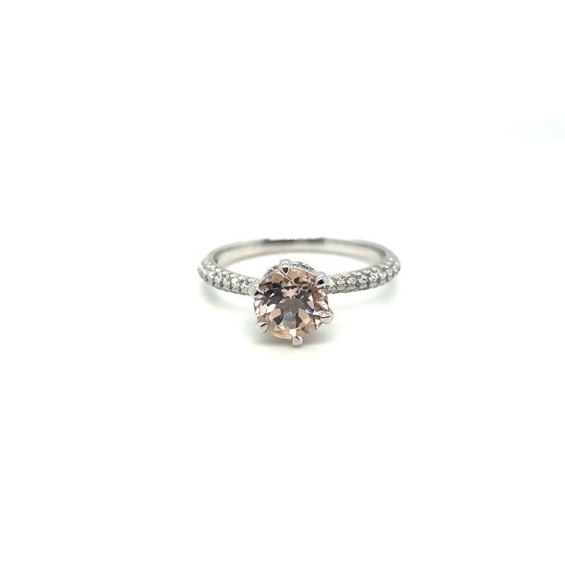 a white gold ring with a brown diamond