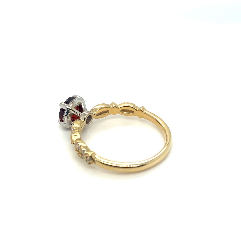 a gold ring with two different colored stones