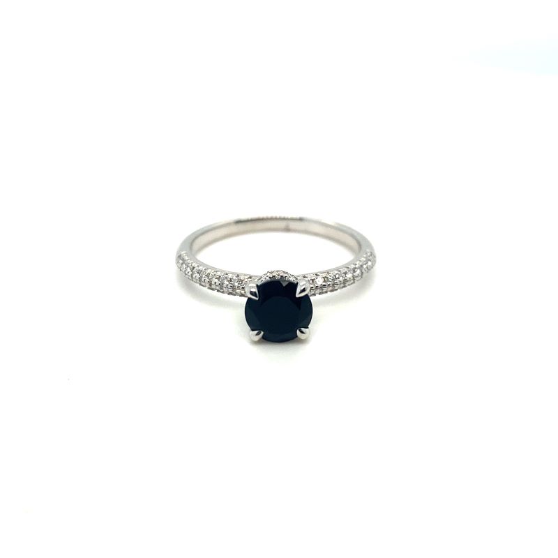 a black and white diamond ring on a white background
