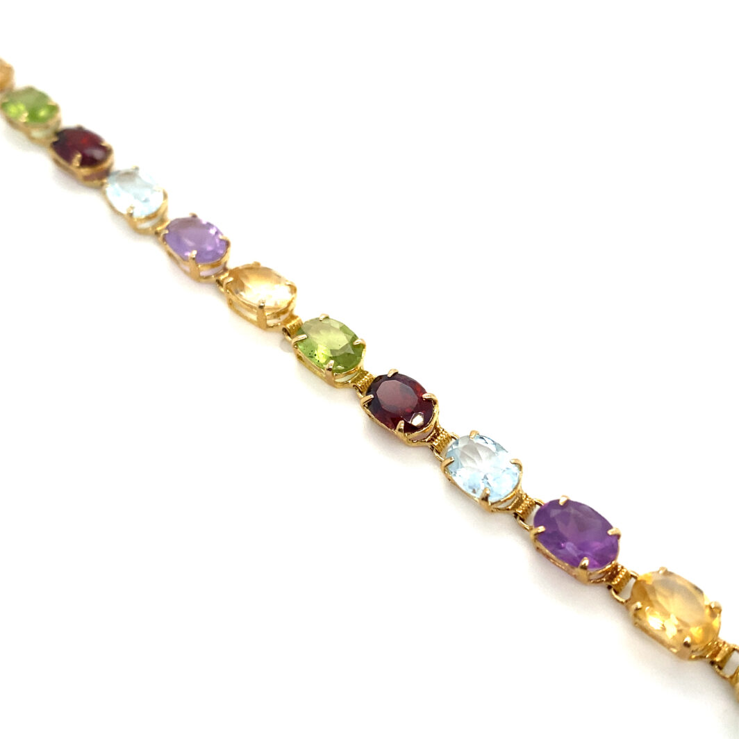 a bracelet with different colored stones on it