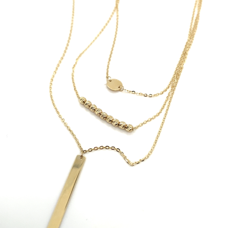 a gold necklace with a long bar on it