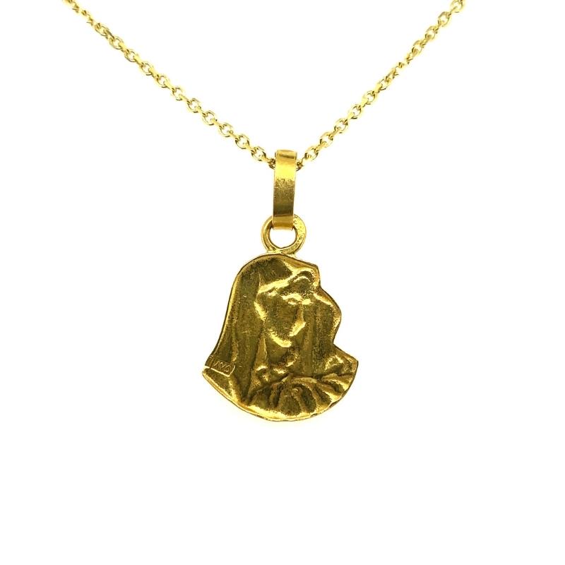 a gold necklace with a small pendant on it