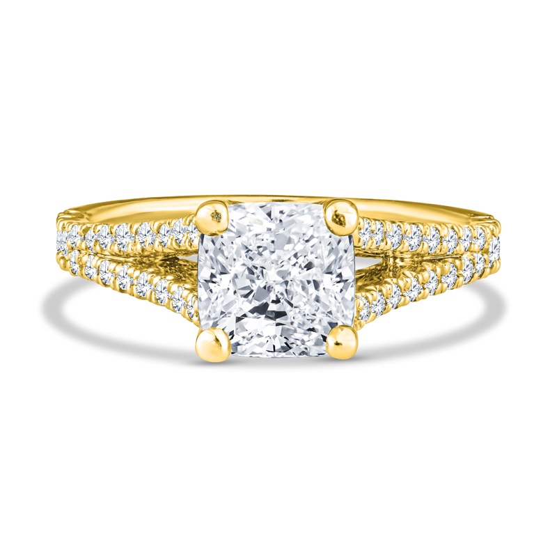 a yellow gold ring with a princess cut diamond