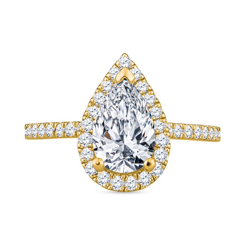 a yellow gold ring with a pear shaped diamond