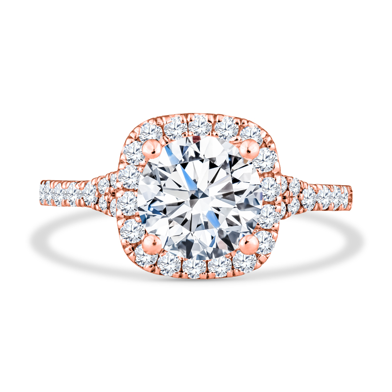a rose gold engagement ring with an oval center surrounded by round diamonds
