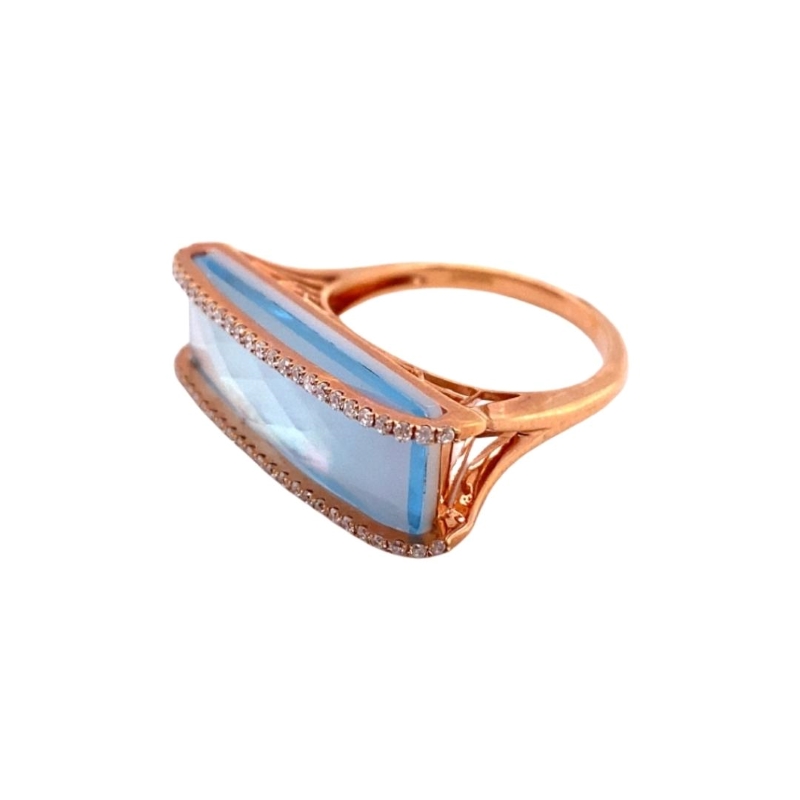 a gold ring with blue and white stones