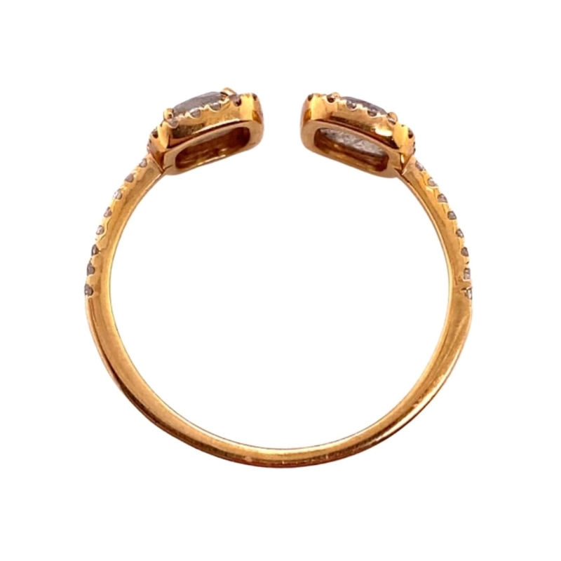 a yellow gold ring with two brown diamonds