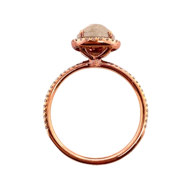 a rose gold ring with an oval shaped diamond