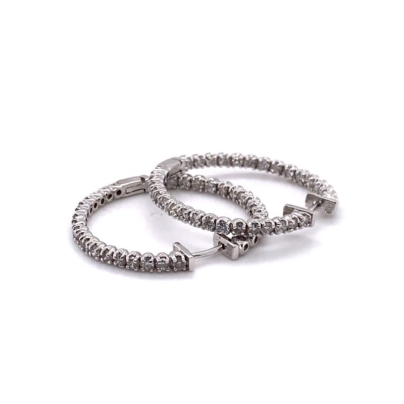 two silver bracelets on a white background