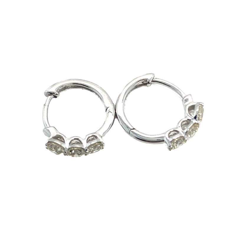 pair of silver tone hoop earrings with crystal stones