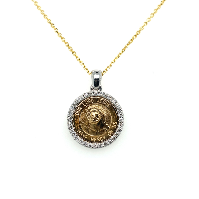a gold and diamond necklace with a coin on it