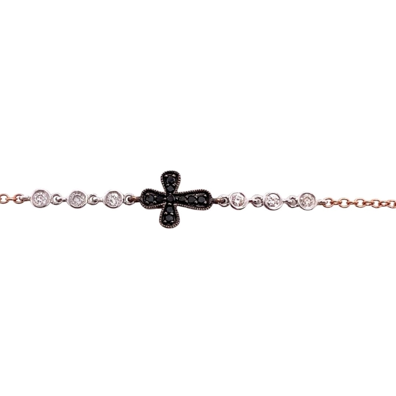 a cross bracelet with black and white stones