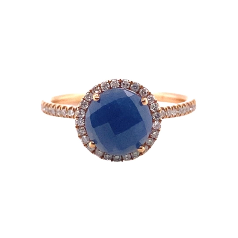 a blue stone and diamond ring on a white background