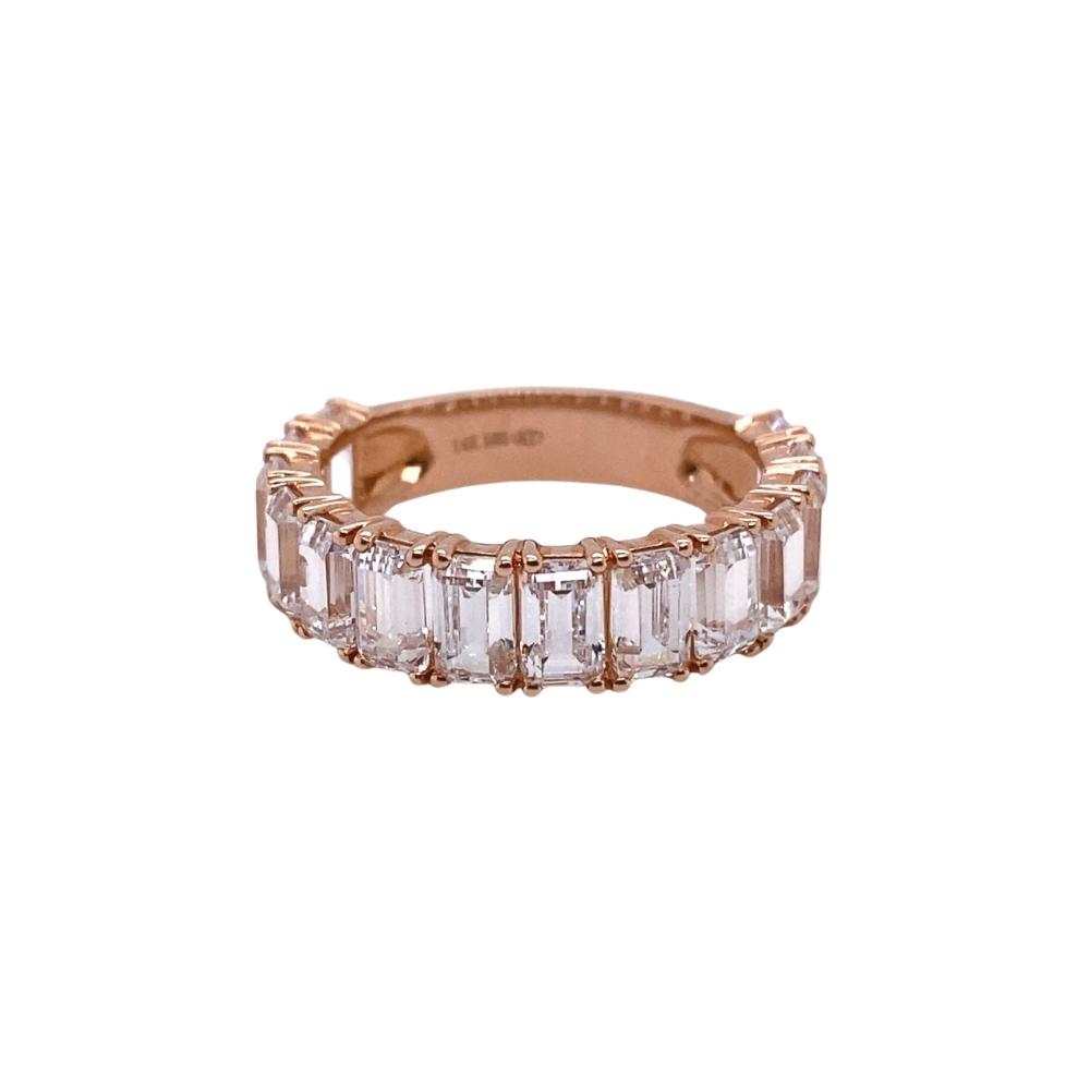 a rose gold ring with baguets