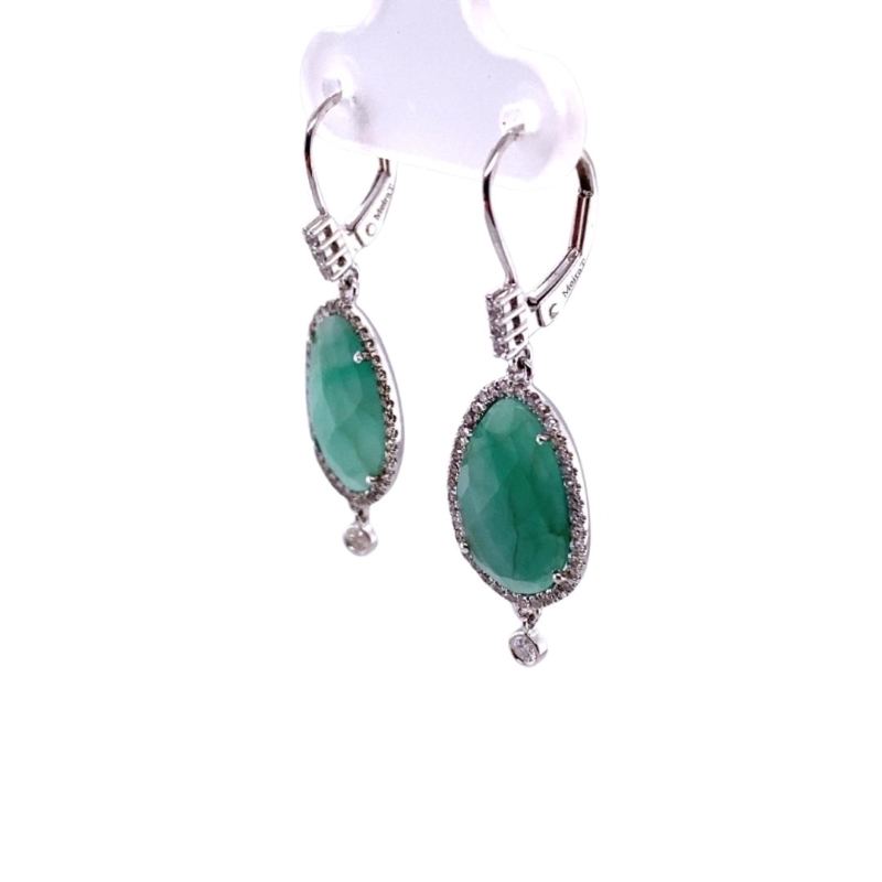 a pair of earrings with green stones and diamonds