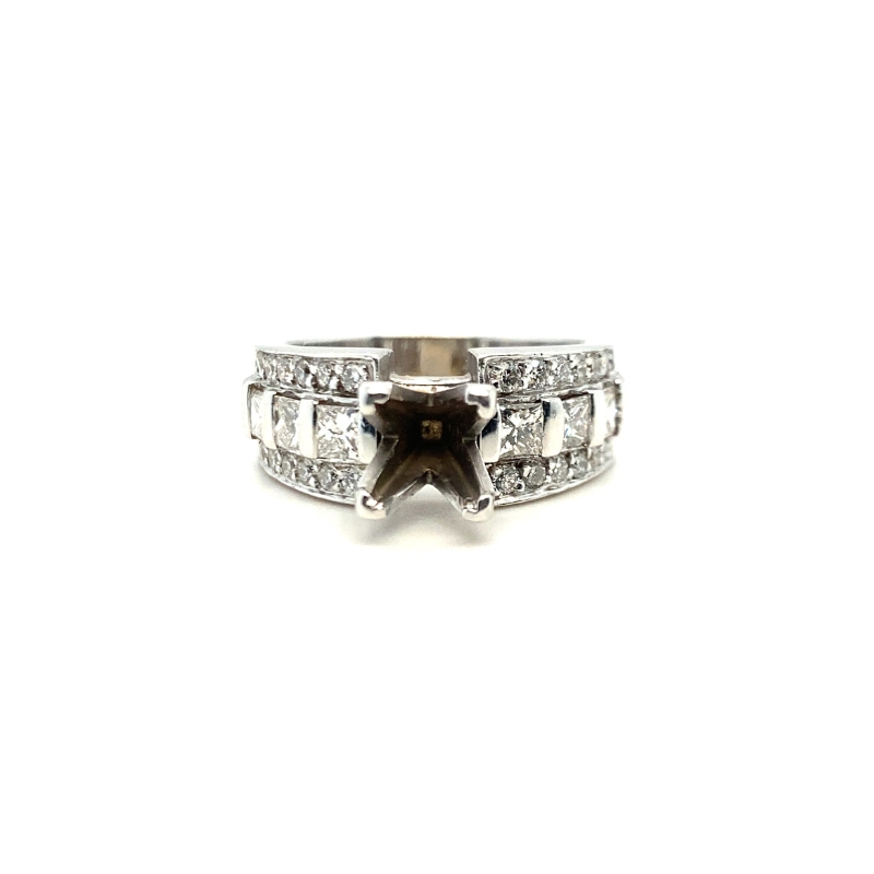 a white gold ring with a star and diamonds