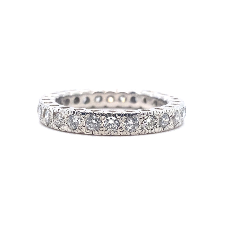 a white gold wedding band with five diamonds