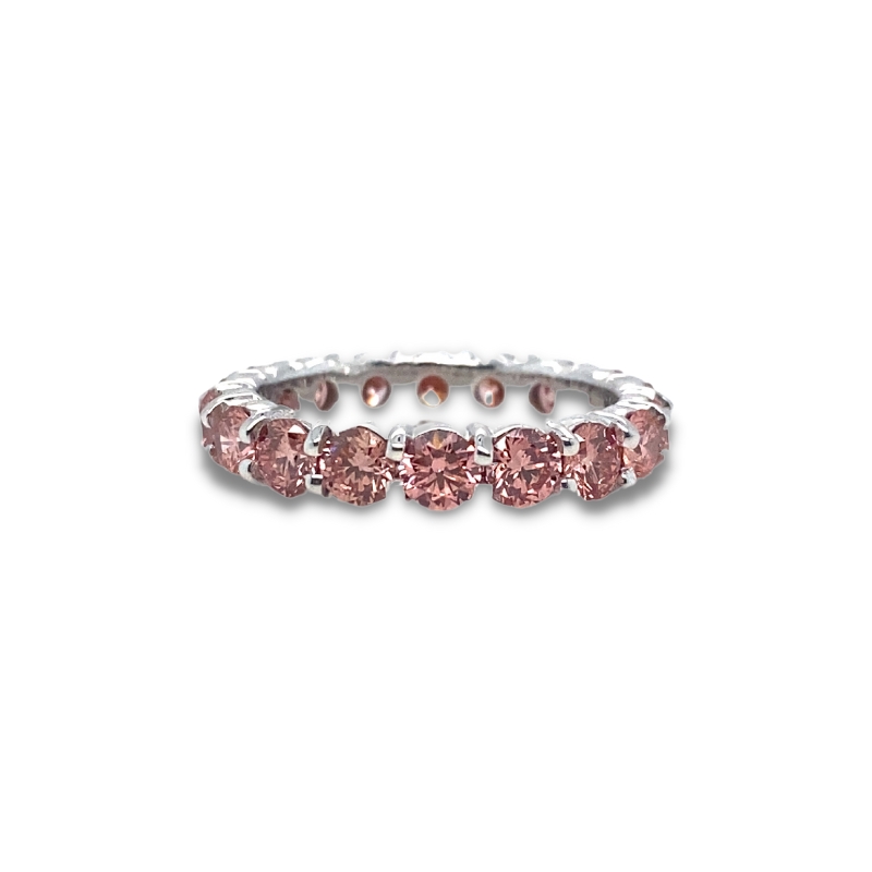 a ring with pink stones on it
