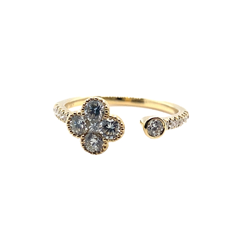 a yellow gold ring with two white diamonds