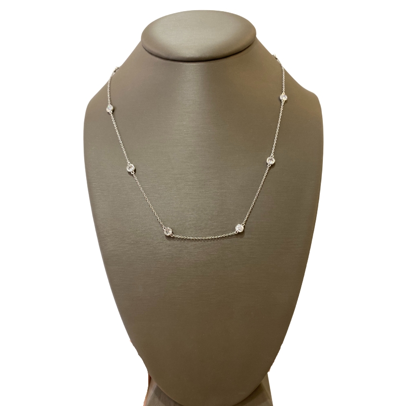 a necklace on a mannequin with diamonds